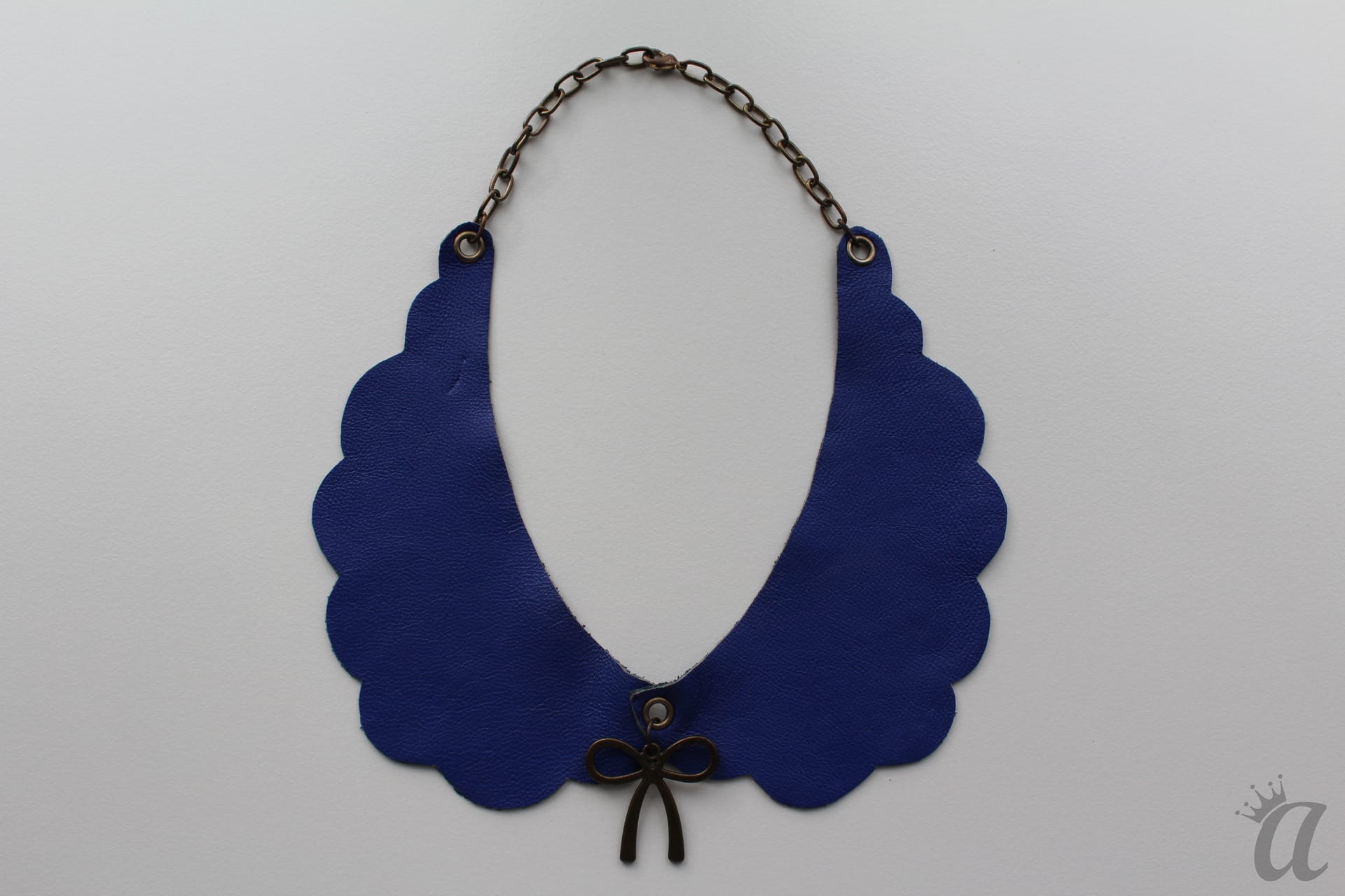 electric blue leather necklace with bow pandant